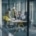 A group of men and women, some in business attire, others in construction attire, talk in a glass conference room.