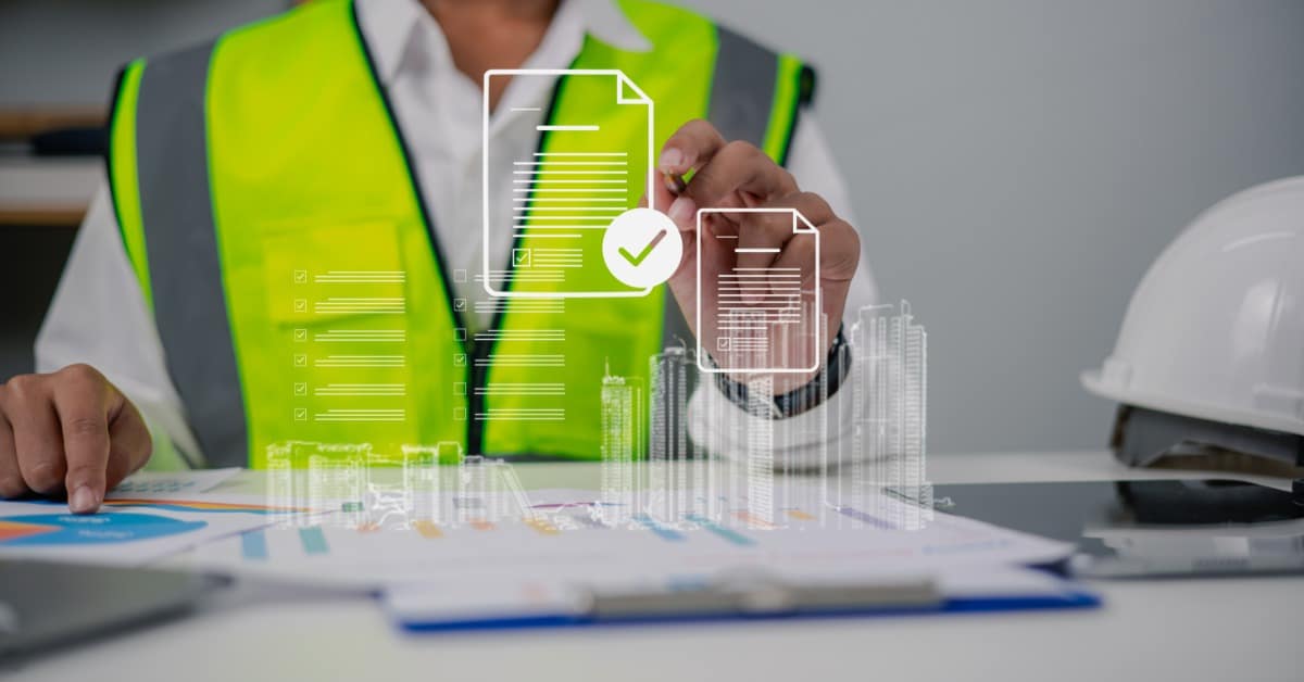 A man in a high-visibility vest sitting at a table, using a holographic digital document interface for construction plans.