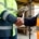 A close-up of two men shaking hands, both wearing high-visibility safety jackets, with one holding an electronic tablet.